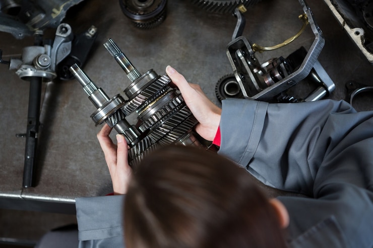 female-mechanic-holding-spare-parts_1170-1610